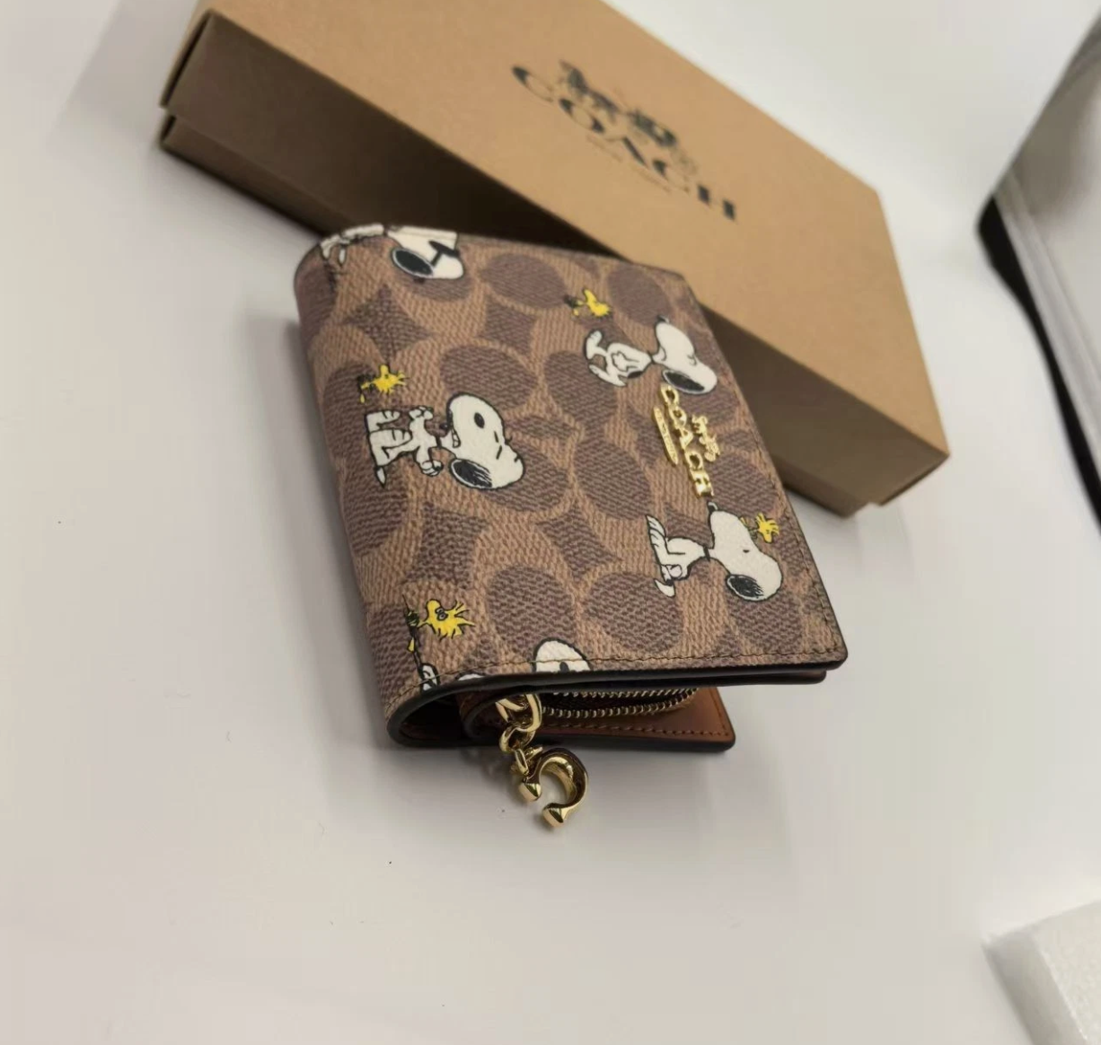 Coach X Peanuts Snap Wallet In Signature Canvas With Snoopy